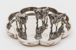 Three Elizabeth II miniature silver pugs and an octofoil tray: maker Samuel Mordan & Co.