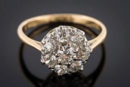 A gold and diamond circular cluster eight-stone ring: with old-cut diamonds estimated to weigh a