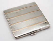A George V silver and gold inlaid cigarette case, maker William Neale & Son Ltd, Birmingham,