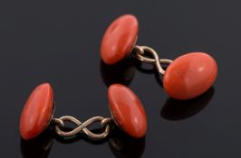 A pair of oval coral two-stone cuff-links:, 9gms gross weight.