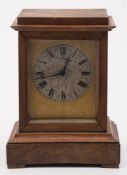 A small French mantel clock: the eight-day duration movement having a tic-tac escapement and