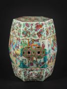 A Cantonese porcelain garden seat: of typical swelling hexagonal form applied with bands of bosses,