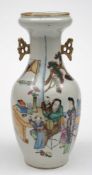 A Chinese porcelain vase: of baluster form with pierced handles and in-scrolling neck,