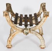 A Victorian cast iron curved X-frame garden stool:, with rosette and guilloche decoration,