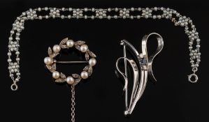 A platinum and seed pearl bracelet: with rosette shaped clusters of seed pearls,