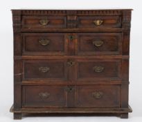 A 17th Century oak rectangular chest:, the top with a dentil edge,