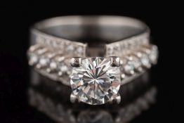 A diamond single-stone ring: the circular, brilliant-cut diamond approximately 7.