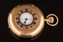 An 18ct gold keyless lever open face fob watch: the circular white enamel dial 32mm diameter with