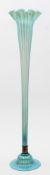 A large floor standing glass vase,