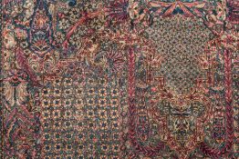 A Tabriz Carpet:, the turquoise field with an all over design of palmettes and flowering foliage,