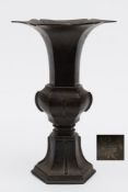 A Chinese bronze vase, Gu: of hexagonal form with lotus petal rim,