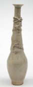 A Chinese Qingbai dragon granary jar: with flared rim,