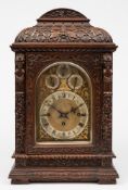 A Victorian carved oak chiming bracket clock: the eight-day duration,