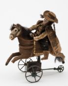 A late 19th/20th Century French clockwork horse and rider:.