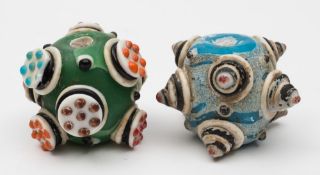 Two Chinese coloured glass ball ornaments: in Han Dynasty style,