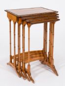 A set of late 19th Century satinwood and inlaid quartetto tables:, bordered with ebony lines,