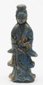 A Chinese carved lapis lazuli figure of Guanyin: wearing flowing robes and holding a scroll in one