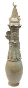 A Chinese celadon glazed funerary jar and a cover: of ovoid form,