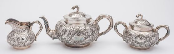 A late 19th/early 20th century Chinese silver three piece tea service, maker WHL,