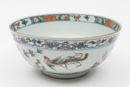A Chinese famille verte bowl: painted with phoenix,