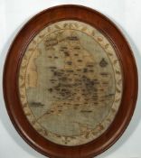 An early 19th century oval needlework map of Britain and Wales: with named counties and principal