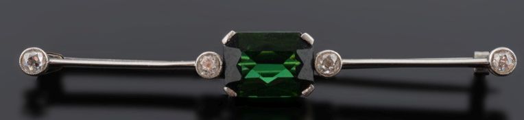 An early 20th century green tourmaline and diamond bar brooch: with central rectangular green