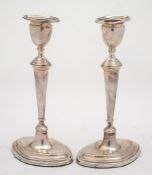 A pair of Edward VII silver candlesticks, maker West & Sons, London,