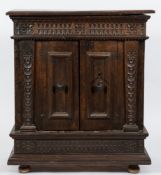 A late 17th/early 18th Century Italian walnut dwarf side cupboard:, the top with a moulded edge,
