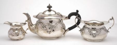 An Edward VII batchelor's silver three-piece tea service, maker's marks worn, Birmingham,