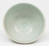 A Chinese pale celadon Qingbai bowl: with everted rim, the interior incised with foliage,