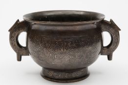 A Chinese silver-wire inlaid bronze censer: of squat baluster form with archaic-style dragon