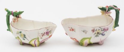 Two Chelsea strawberry leaf sauceboats: each with rustic stalk handle applied with strawberries and