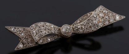 A gold and diamond ribbon bow brooch: pavé-set with round diamonds estimated to weigh a total of 1.
