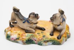 A Worcester porcelain pug group: after a Meissen original,