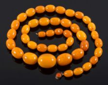 A graduated amber coloured bead,