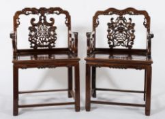 Two similar Chinese carved Hua Li wood armchairs:,