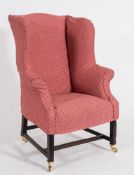 A late 19th Century mahogany frame wing armchair:, in the Georgian taste,