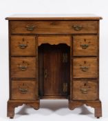 A mid 18th Century mahogany kneehole desk:,