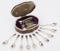 A set of sixteen Dutch silver coffee spoons and matching sugar tongs: contained in a figured walnut