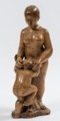 A carved olivewood figure group: mother and child,