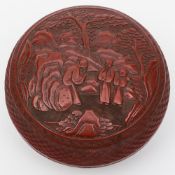 A 19th century Chinese cinnabar lacquer bowl and cover: of circular outline,