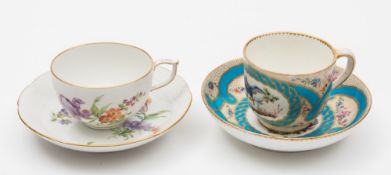 A Berlin cup and saucer and a Sevres-style cup and saucer: the first with wishbone handle and ozier