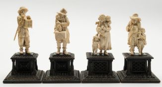 A group of four German carved ivory figures: one pair depicting a mother with her three children