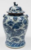 A Chinese porcelain 'dragons' jar and cover: the jar of baluster form with four mask handles