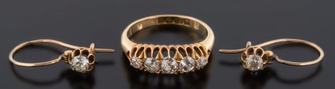 A late 19th century gold and diamond five-stone ring: with graduated cushion-shaped old