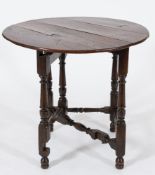 An 18th Century oak circular single drop flap gateleg or credence table:,