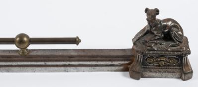 A late 19th century French small metal fender: the main rail terminating with seated dogs on plinth