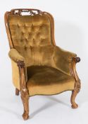 A Victorian carved rosewood armchair:,