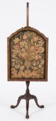 A carved walnut polescreen in the early 18th Century taste:,