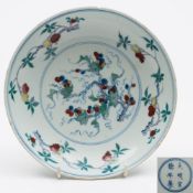 A Chinese Doucai porcelain dish: the centre decorated in under glaze blue and red and over glaze
